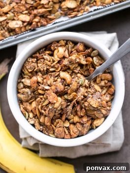 This Banana Almond Butter Grain Free Granola is a crunchy + filling snack, made without any grains or refined sugars! It makes the perfect yogurt or smoothie bowl topping, or just grab a handful to hold you over until your next meal.
