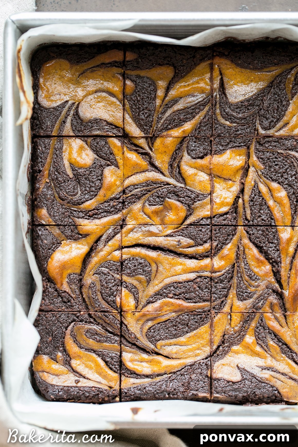 These Pumpkin Cheesecake Brownies are moist + fudgy brownies with a swirled layer of spiced pumpkin cheesecake! These brownies are gluten-free and refined sugar free.