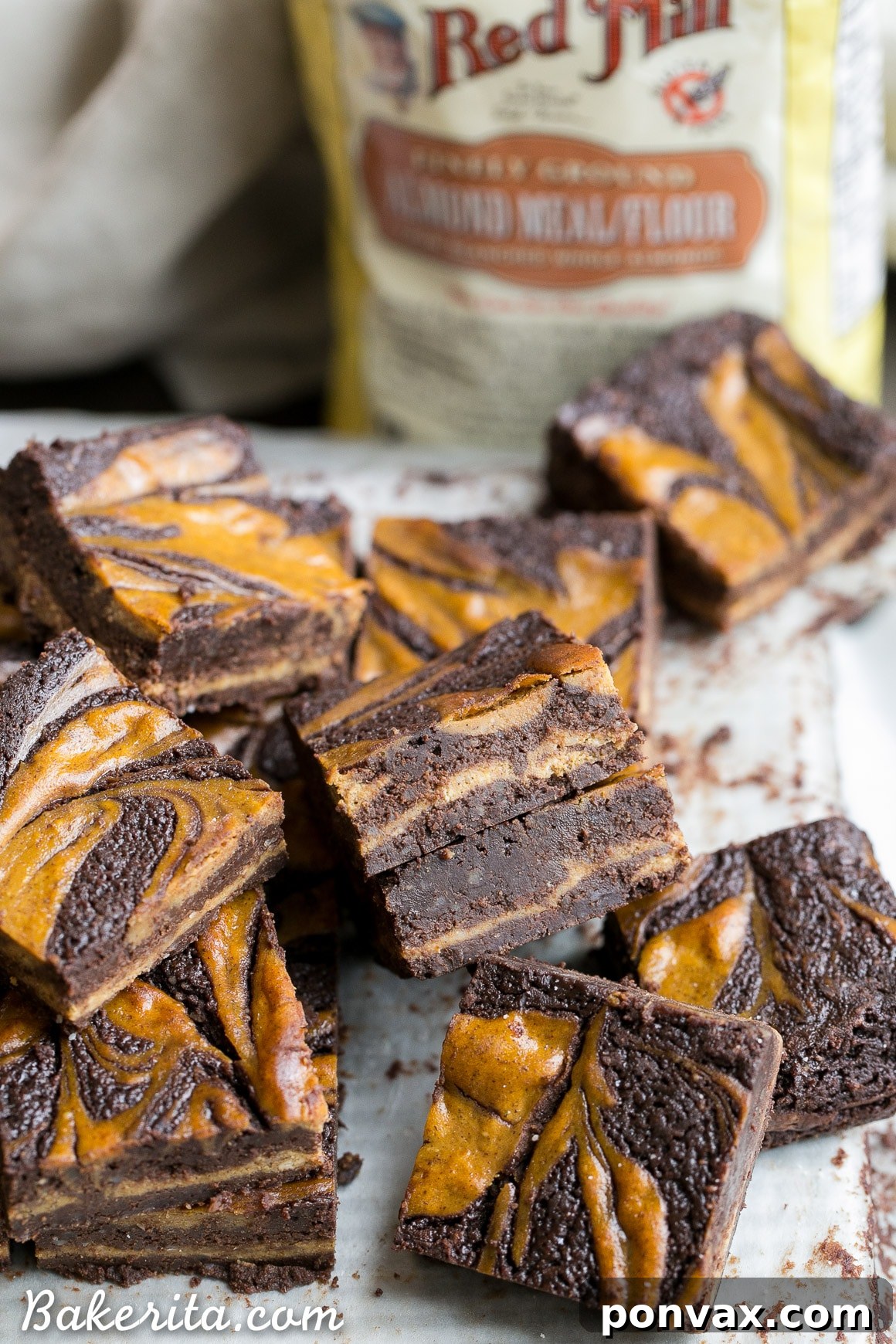 These Pumpkin Cheesecake Brownies are moist + fudgy brownies with a swirled layer of spiced pumpkin cheesecake! These brownies are gluten-free and refined sugar free.