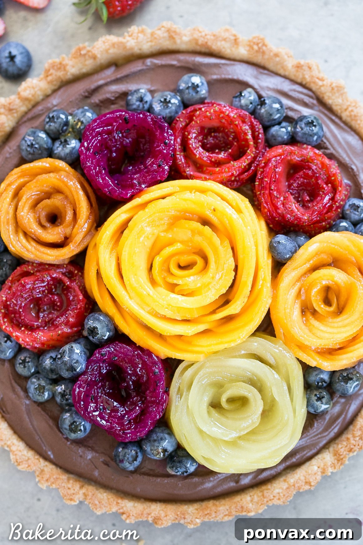 Close-up of the delicious Vegan Chocolate Mousse Tart, highlighting the creamy texture of the chocolate filling and the crisp, golden-brown Coconut Crust, ready to be adorned with fruit.