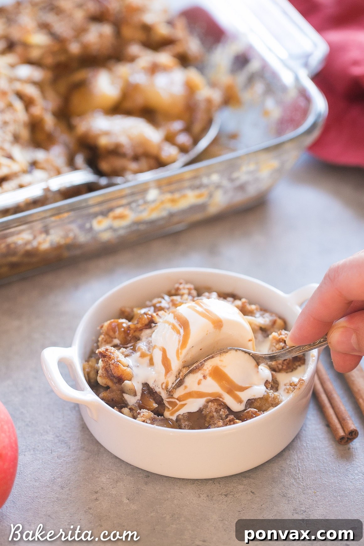 A freshly baked Apple Pear Crisp, bubbling with fruit juices and topped with a golden-brown, crunchy crumble. The edges are perfectly caramelized, and the entire dish exudes a warm, inviting aroma, ready to be enjoyed as a wholesome, gluten-free, Paleo, and vegan dessert.