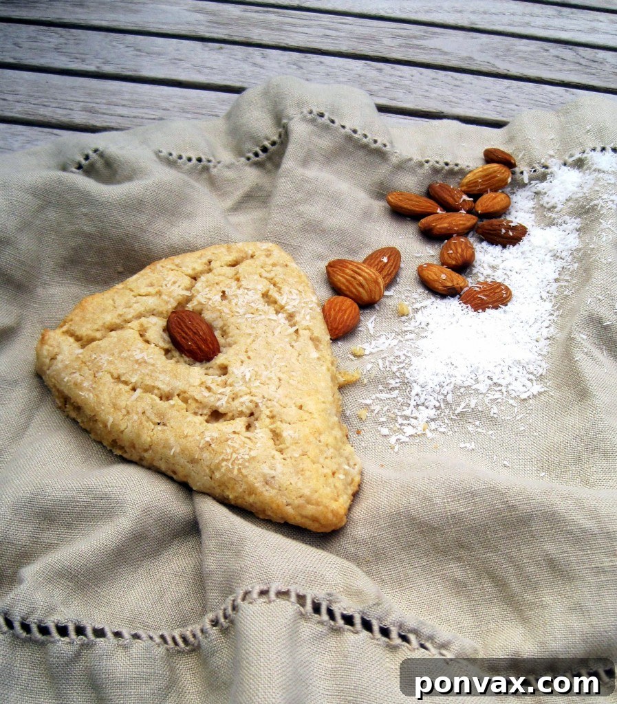 Whole Wheat Coconut Almond Scones - Moist, Healthy & Flavorful Deliciously moist Whole Wheat Coconut Almond Scones with flaky coconut and whole almonds on top.