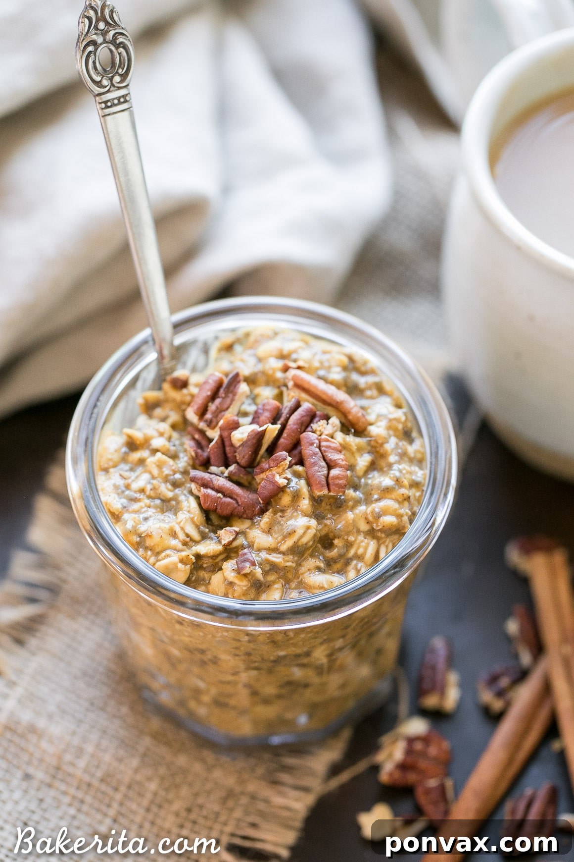 Autumn Spiced Latte Overnight Oats 2 Creamy Pumpkin Spice Latte Overnight Oats topped with toasted pecans, ready for a delicious fall breakfast.