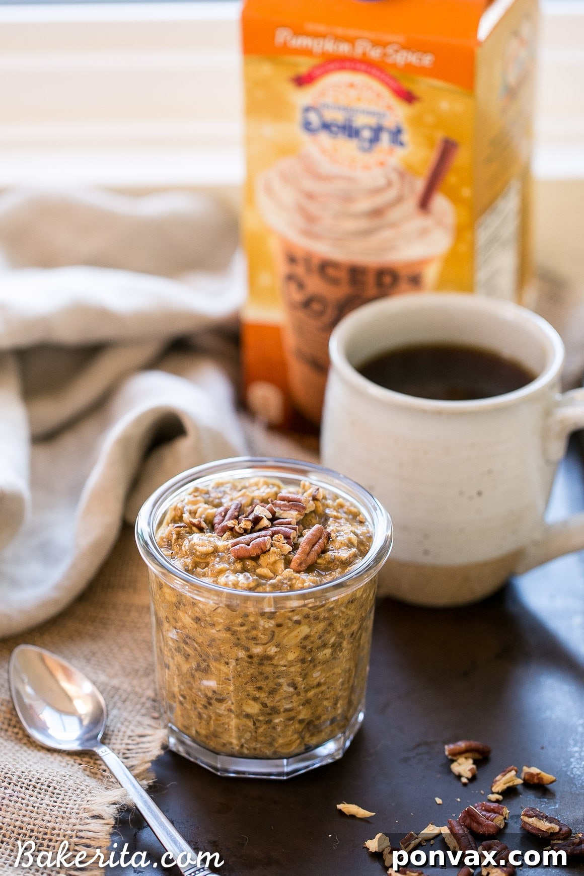Autumn Spiced Latte Overnight Oats 4 A spoon scooping a portion of creamy Pumpkin Spice Latte Overnight Oats from a jar.