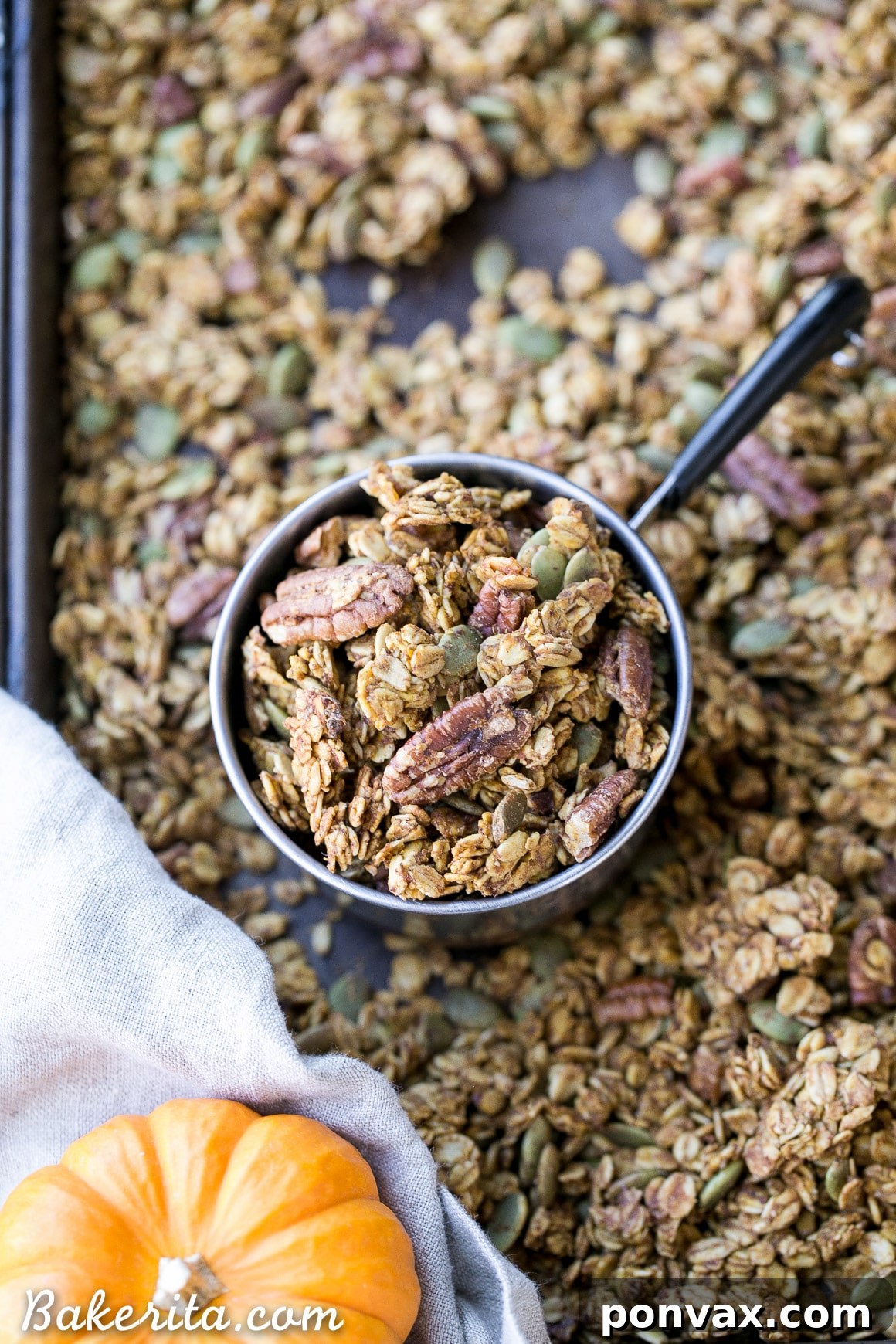 A bowl of homemade Pumpkin Granola, rich with pecans, pepitas, and a hint of maple, perfect for a cozy fall breakfast.