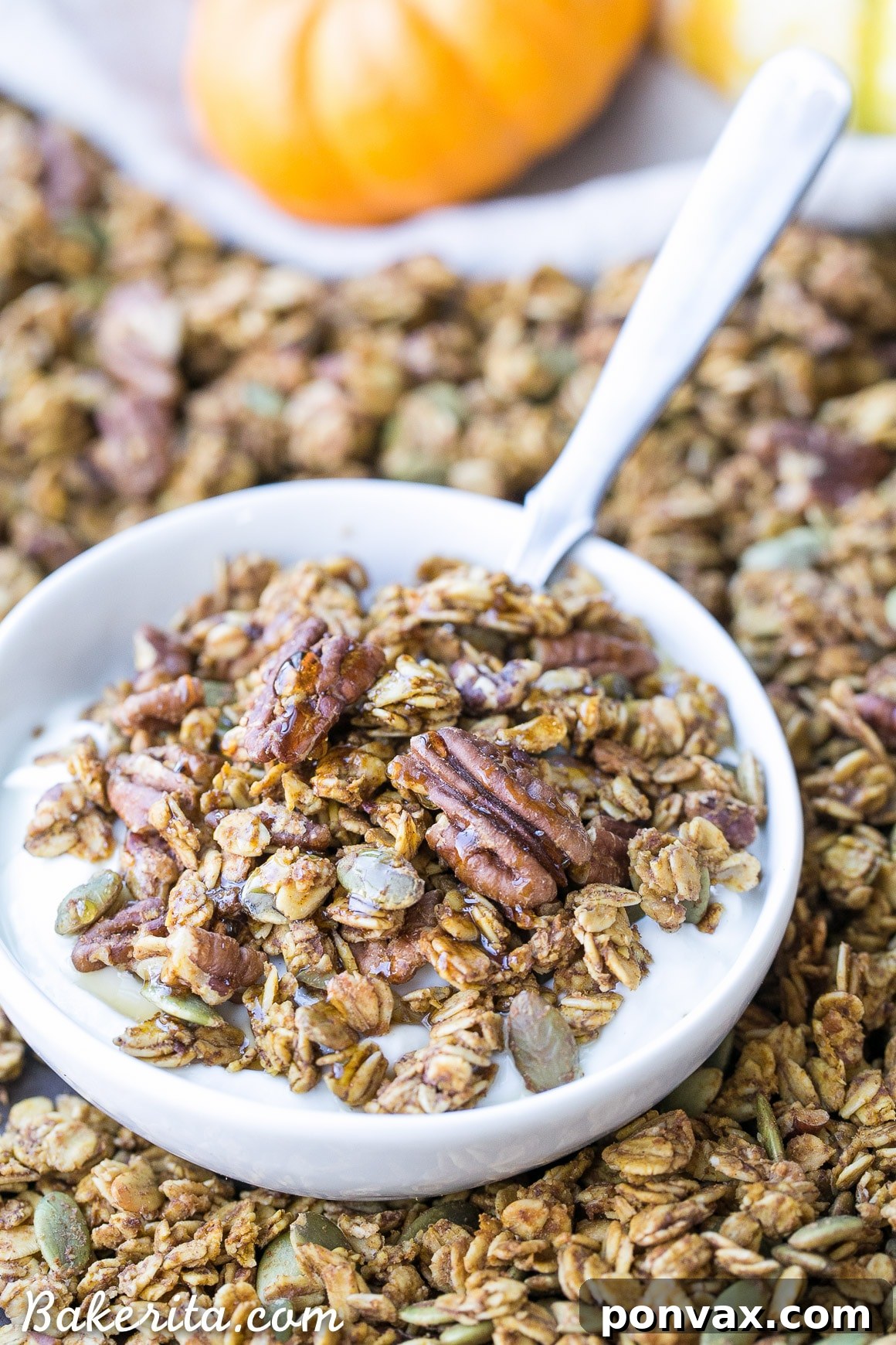A generous serving of Pumpkin Granola in a rustic bowl, ready to be enjoyed as a wholesome breakfast or snack.
