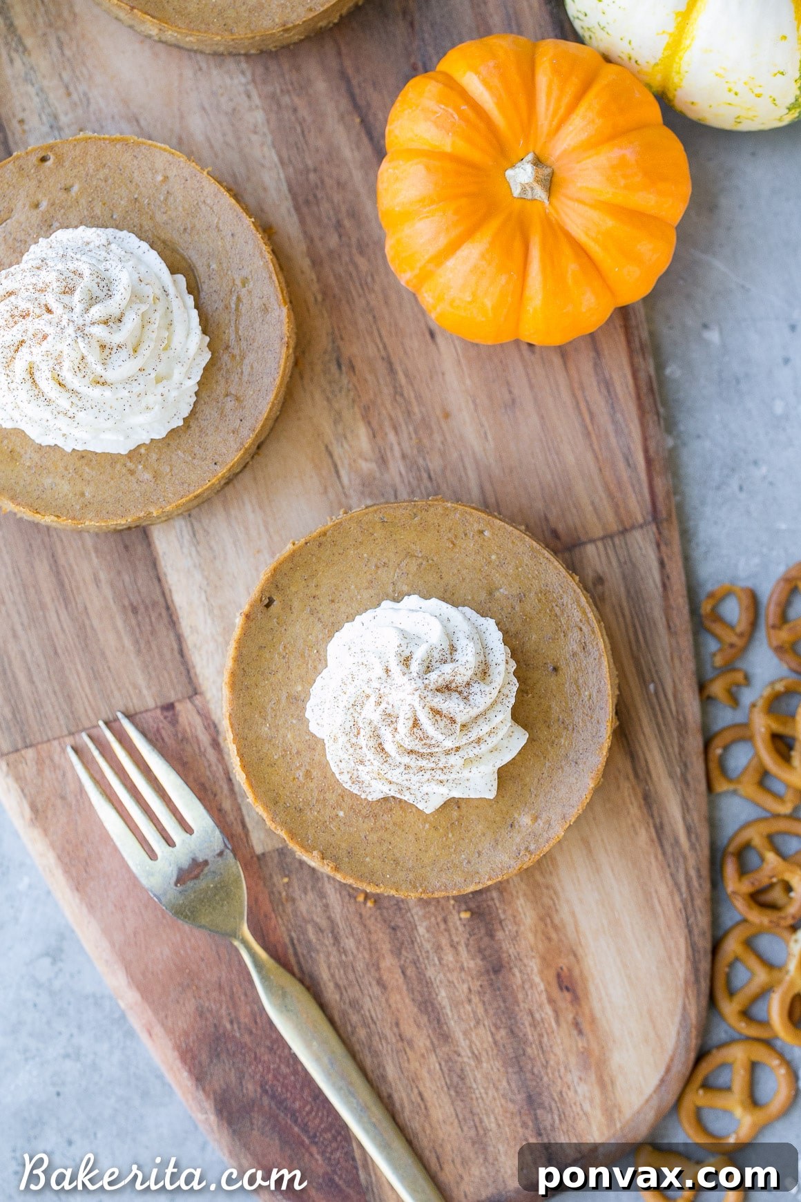 These Mini Pumpkin Cheesecakes have a crunchy, salty pretzel crust that pairs irresistibly well with the spiced pumpkin cheesecake filling! Topped with a swirl of whipped cream, this is a gluten-free dessert everyone will go nuts for - it's perfect for the holidays.