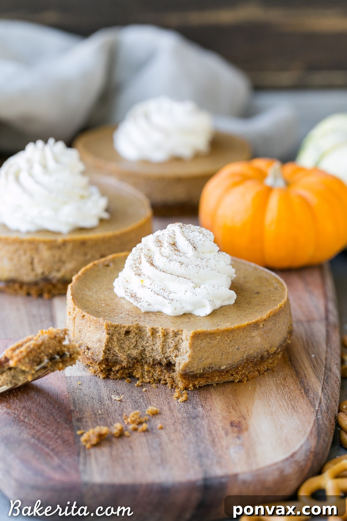 These Mini Pumpkin Cheesecakes have a crunchy, salty pretzel crust that pairs irresistibly well with the spiced pumpkin cheesecake filling! Topped with a swirl of whipped cream, this is a gluten-free dessert everyone will go nuts for - it's perfect for the holidays.