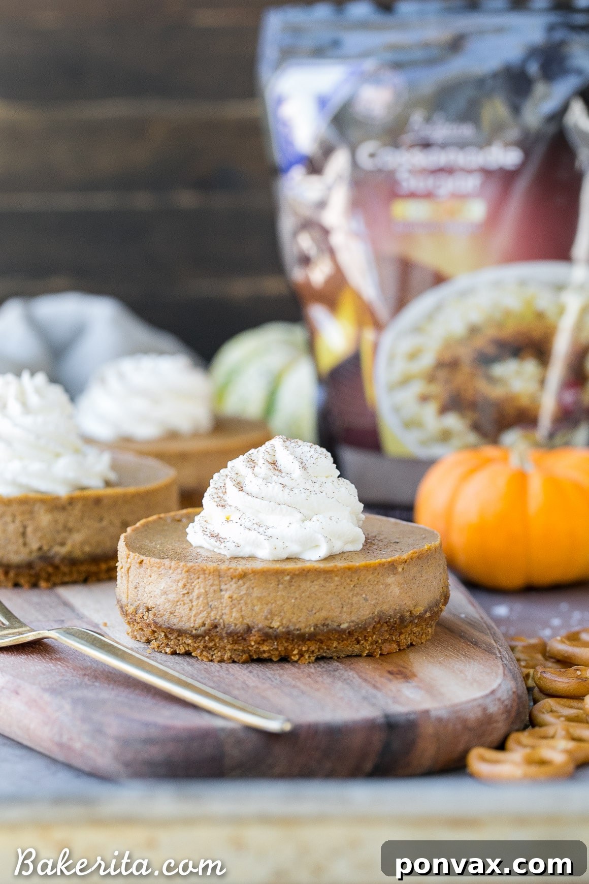 These Mini Pumpkin Cheesecakes have a crunchy, salty pretzel crust that pairs irresistibly well with the spiced pumpkin cheesecake filling! Topped with a swirl of whipped cream, this is a gluten-free dessert everyone will go nuts for - it's perfect for the holidays.