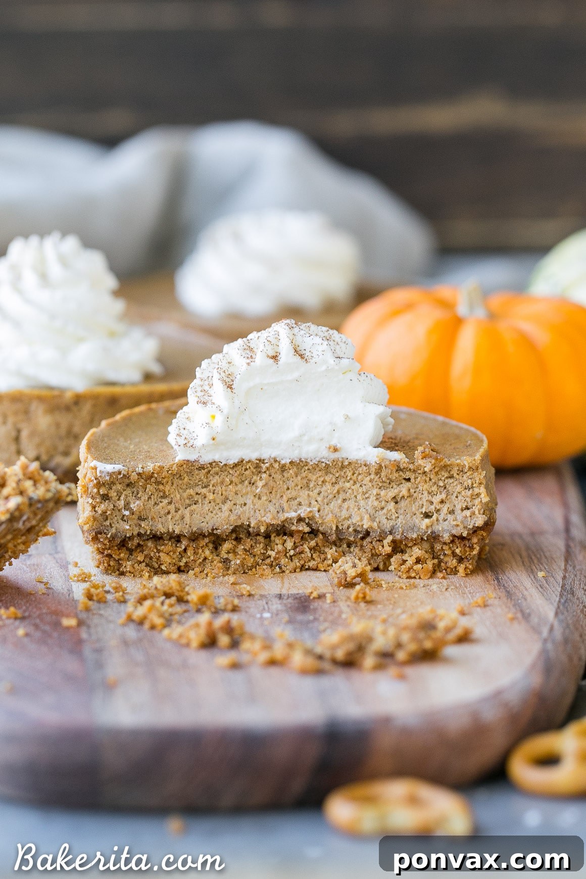 These Mini Pumpkin Cheesecakes have a crunchy, salty pretzel crust that pairs irresistibly well with the spiced pumpkin cheesecake filling! Topped with a swirl of whipped cream, this is a gluten-free dessert everyone will go nuts for - it's perfect for the holidays.