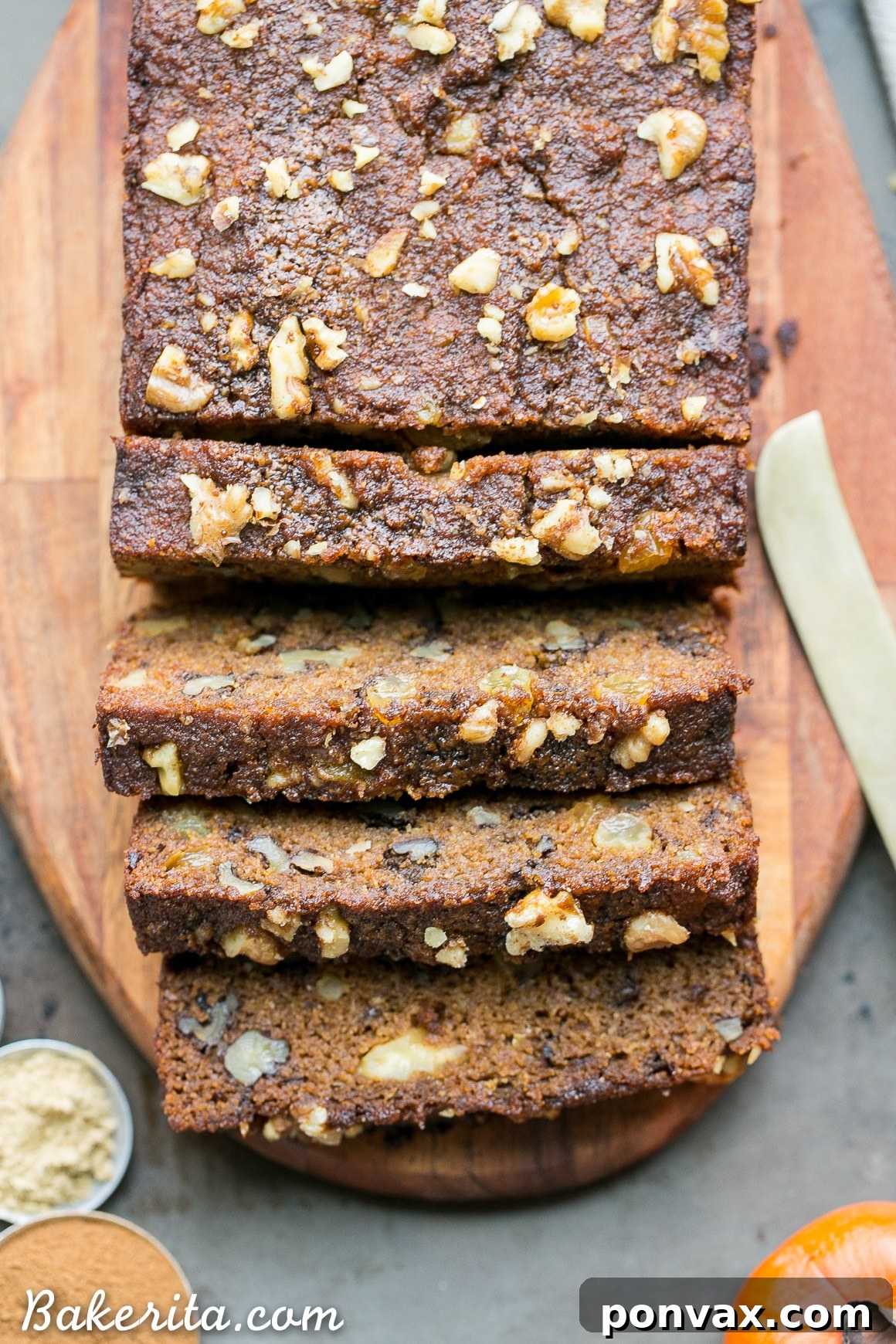 A perfectly baked loaf of healthy Paleo Persimmon Bread, ready to be sliced and enjoyed.