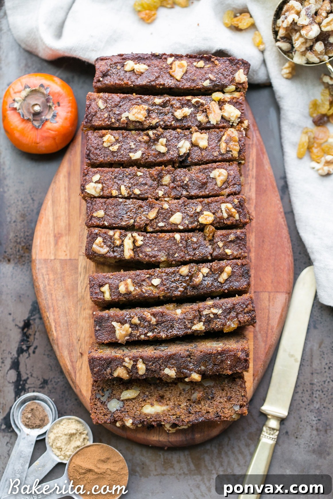 Freshly baked Paleo Persimmon Bread cooling on a wire rack, steam gently rising.