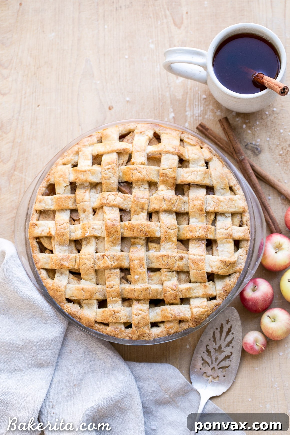 Paleo Apple Pie Perfection, Vegan Style 2 A stunning Paleo Apple Pie with a golden, flaky lattice crust and a visible spiced apple filling, ready to be served as a healthy holiday dessert.