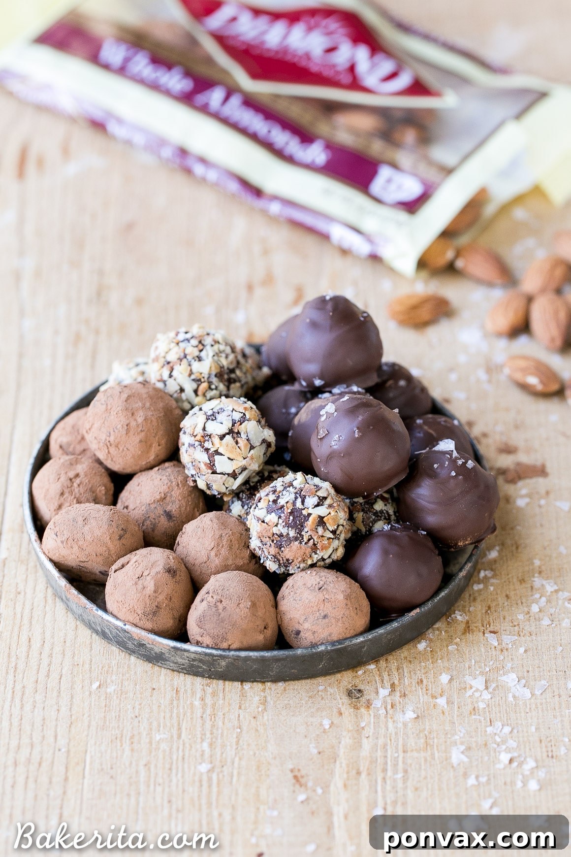 Sea Salt Almond Chocolate Delights 5 Ingredients for Salted Almond Chocolate Truffles, including dark chocolate, coconut milk, toasted almonds, and flaky sea salt.