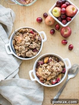This Cranberry Apple Crisp is spiced with cinnamon, nutmeg & orange zest and topped with a crunchy pecan oatmeal crisp topping. This gluten-free and vegan crisp is the perfect holiday dessert!