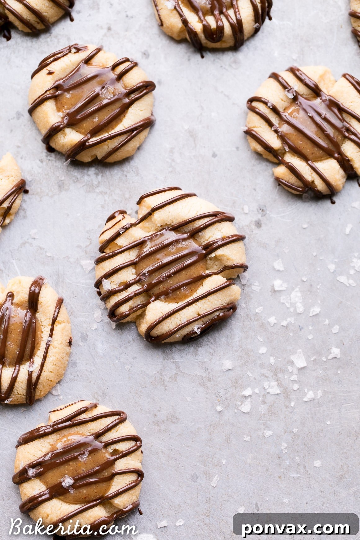 Decadent Gluten Free Salted Caramel Thumbprint Bites 4 These Salted Caramel Thumbprint Cookies are super easy to make with only 6 ingredients total! The tender gluten-free and Paleo shortbread cookies are filled with a no-cook vegan caramel and topped off with a dark chocolate drizzle and flaky sea salt. They're perfect for the holidays!