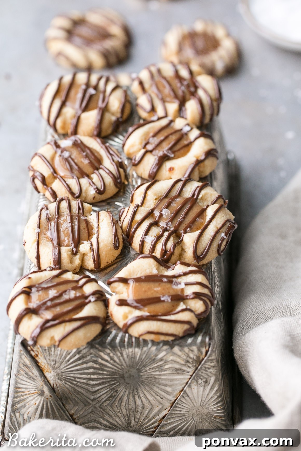 Decadent Gluten Free Salted Caramel Thumbprint Bites 5 These Salted Caramel Thumbprint Cookies are super easy to make with only 6 ingredients total! The tender gluten-free and Paleo shortbread cookies are filled with a no-cook vegan caramel and topped off with a dark chocolate drizzle and flaky sea salt. They're perfect for the holidays!