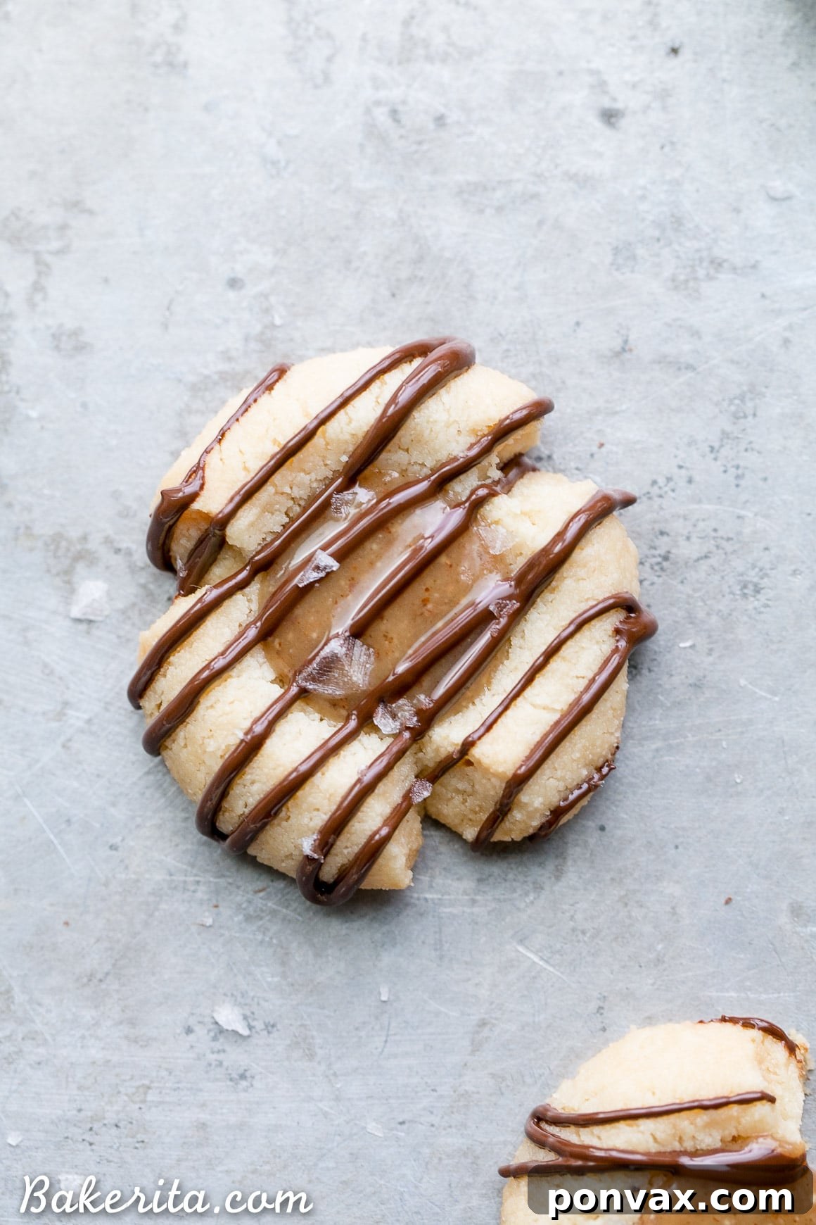 Decadent Gluten Free Salted Caramel Thumbprint Bites 6 These Salted Caramel Thumbprint Cookies are super easy to make with only 6 ingredients total! The tender gluten-free and Paleo shortbread cookies are filled with a no-cook vegan caramel and topped off with a dark chocolate drizzle and flaky sea salt. They're perfect for the holidays!