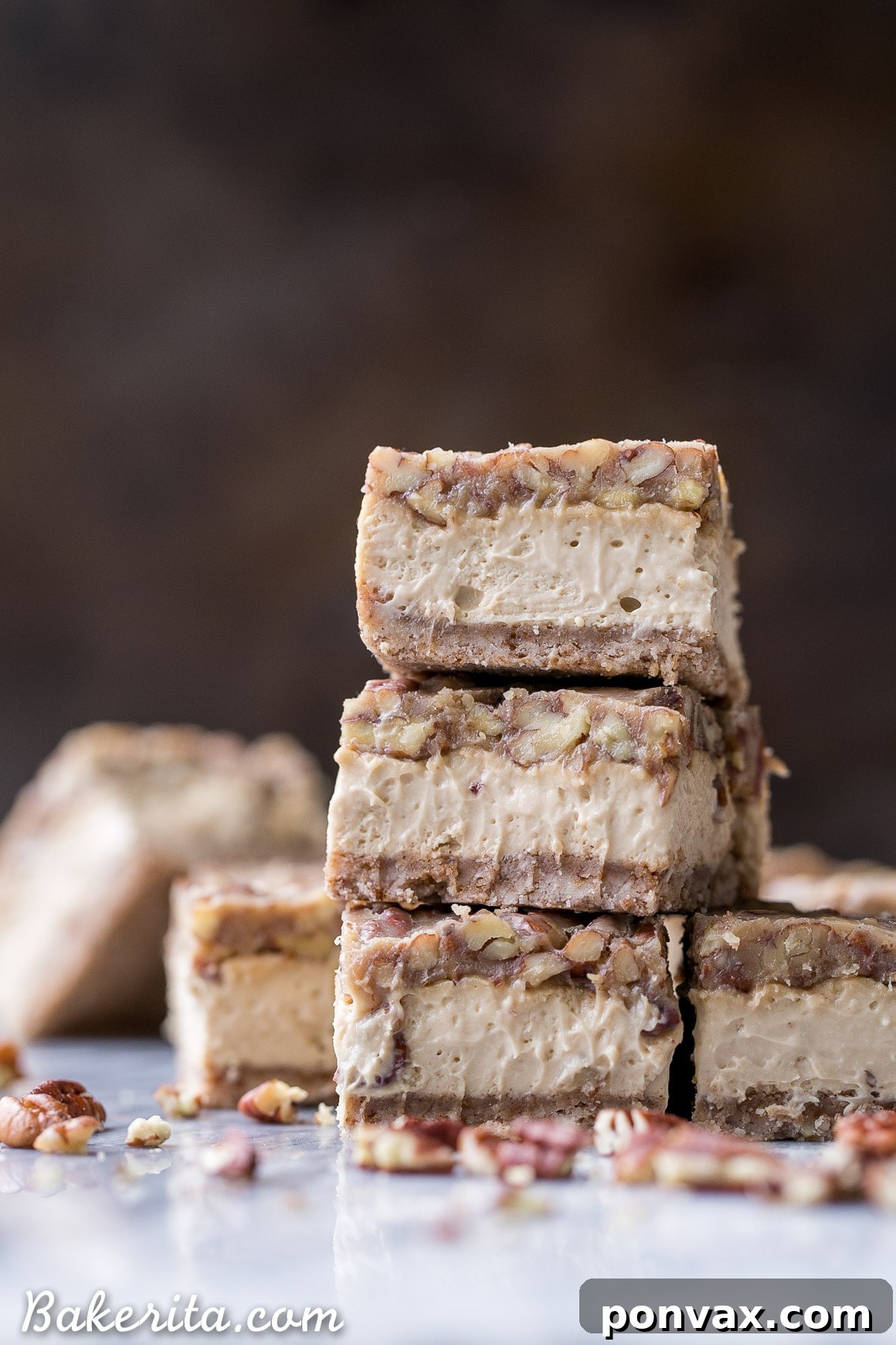 Delicious Pecan Praline Cheesecake Bars on a festive wooden board, perfect for holiday gatherings