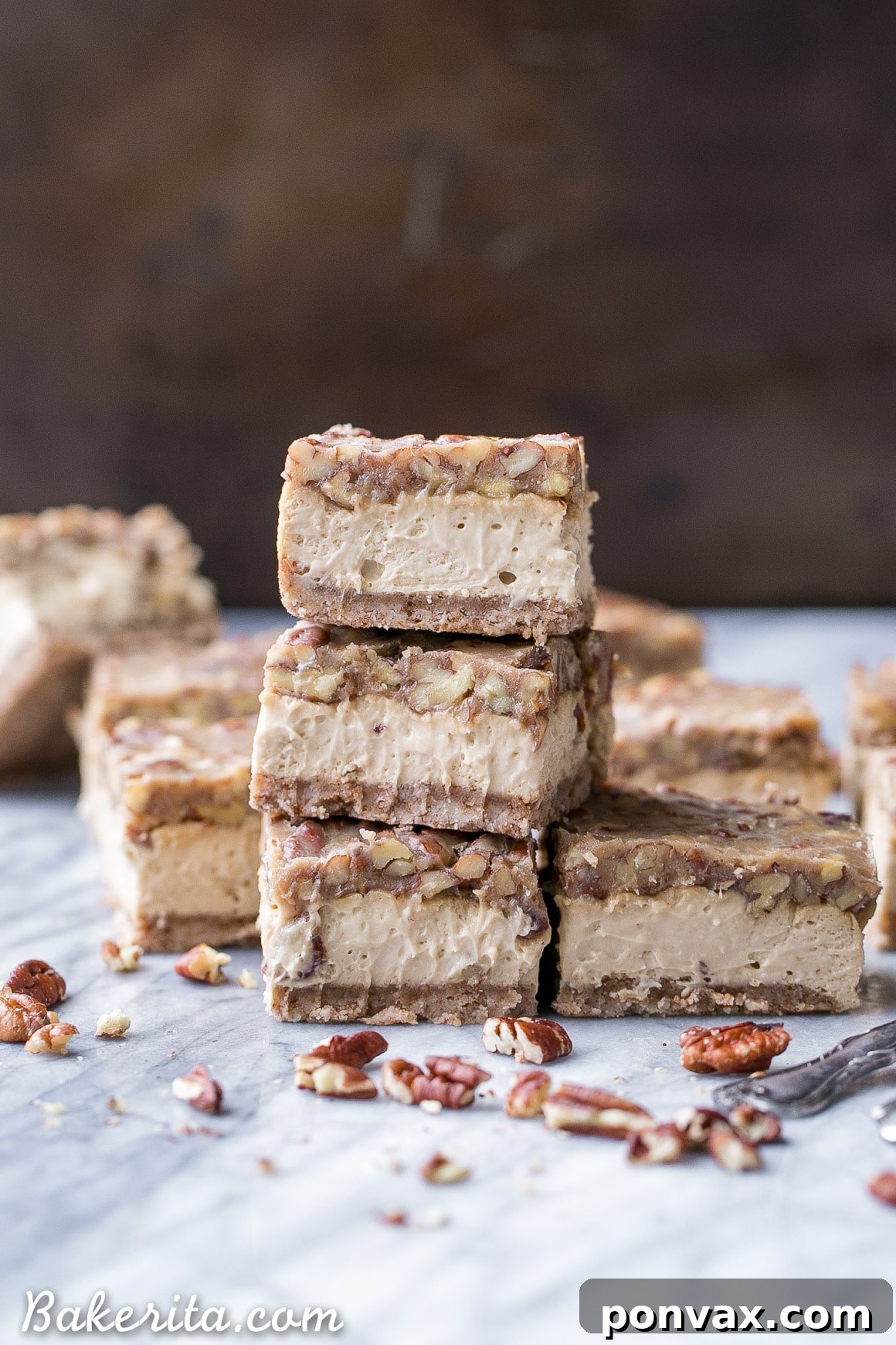 An overhead shot of several Pecan Praline Cheesecake Bars neatly cut and arranged for serving