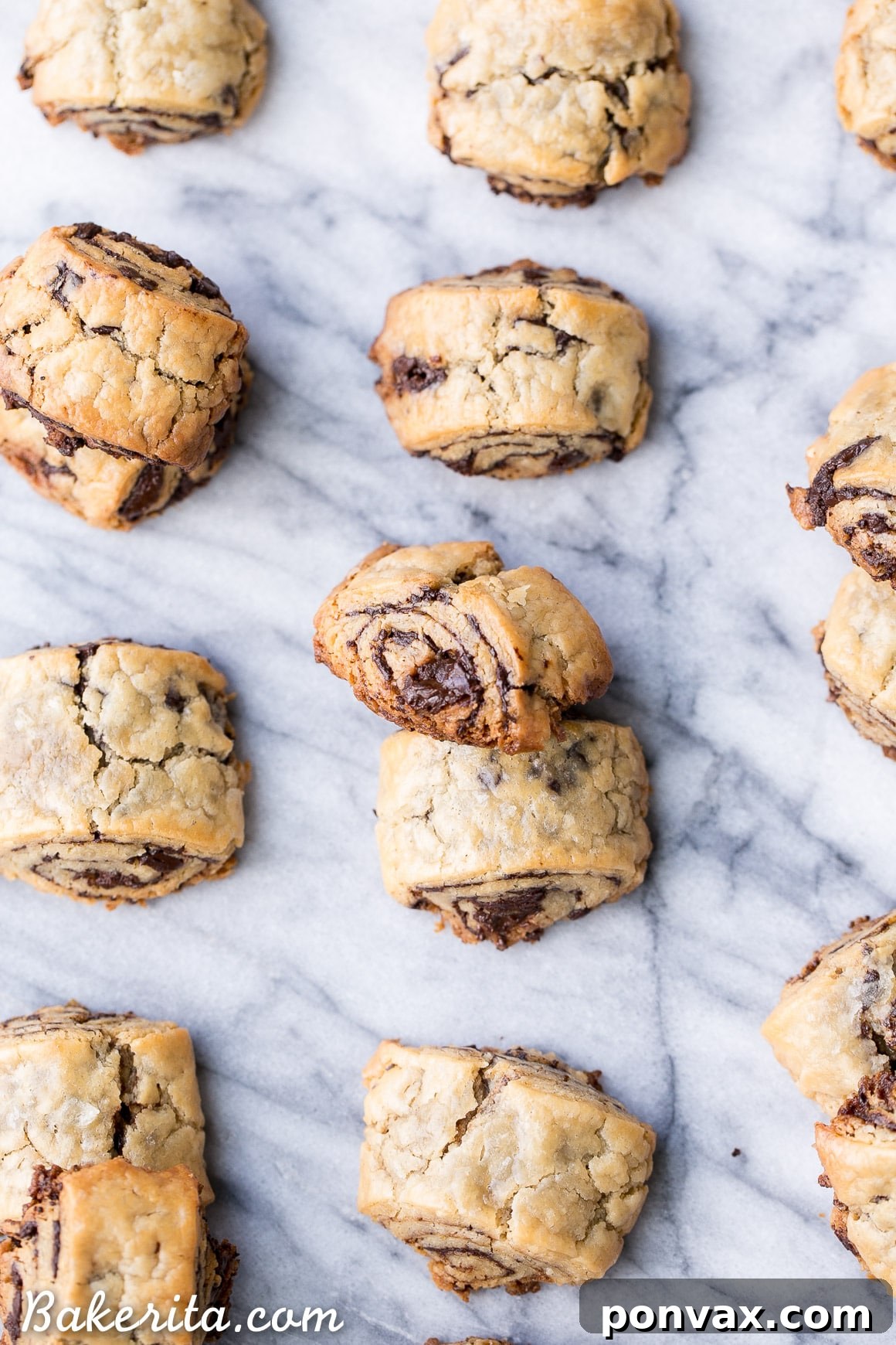 Beautifully baked gluten-free and refined sugar-free chocolate rugelach, showcasing their tender, flaky texture and dark chocolate filling, ideal for holiday gatherings.