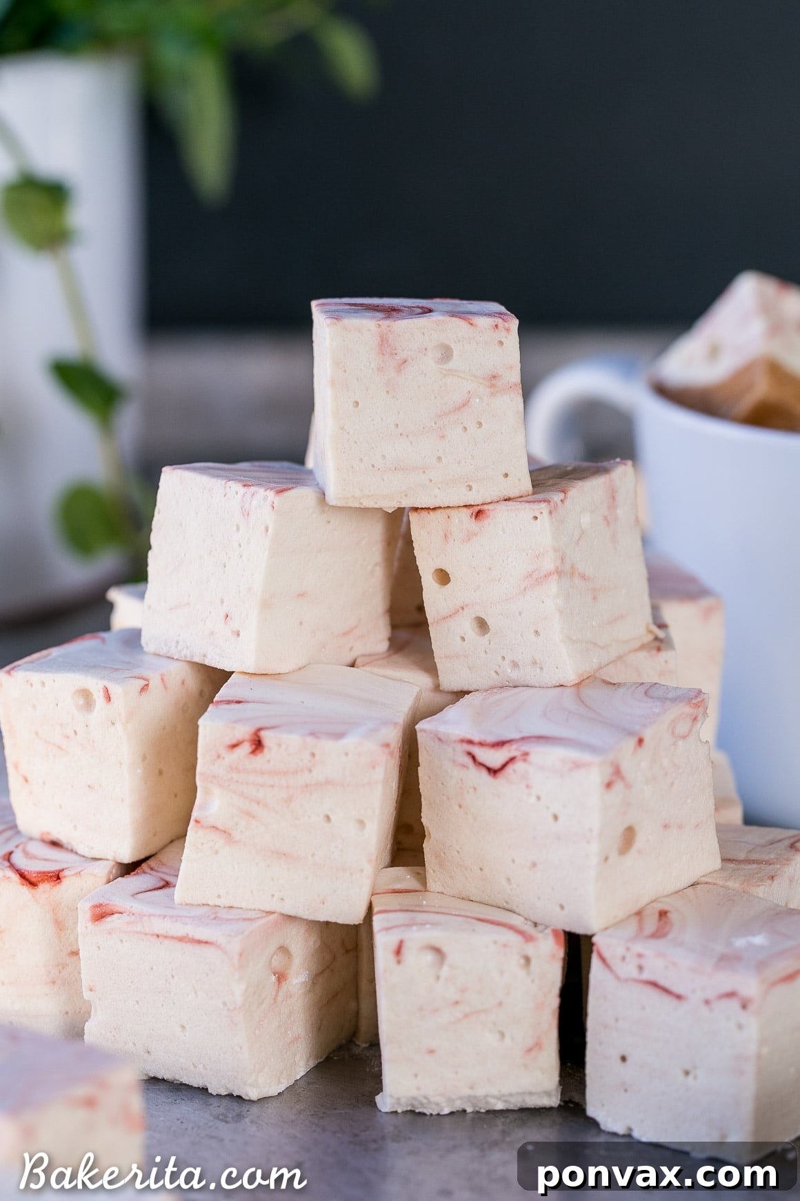 Freshly cut Paleo Peppermint Marshmallows dusted with tapioca flour, showing off their layers