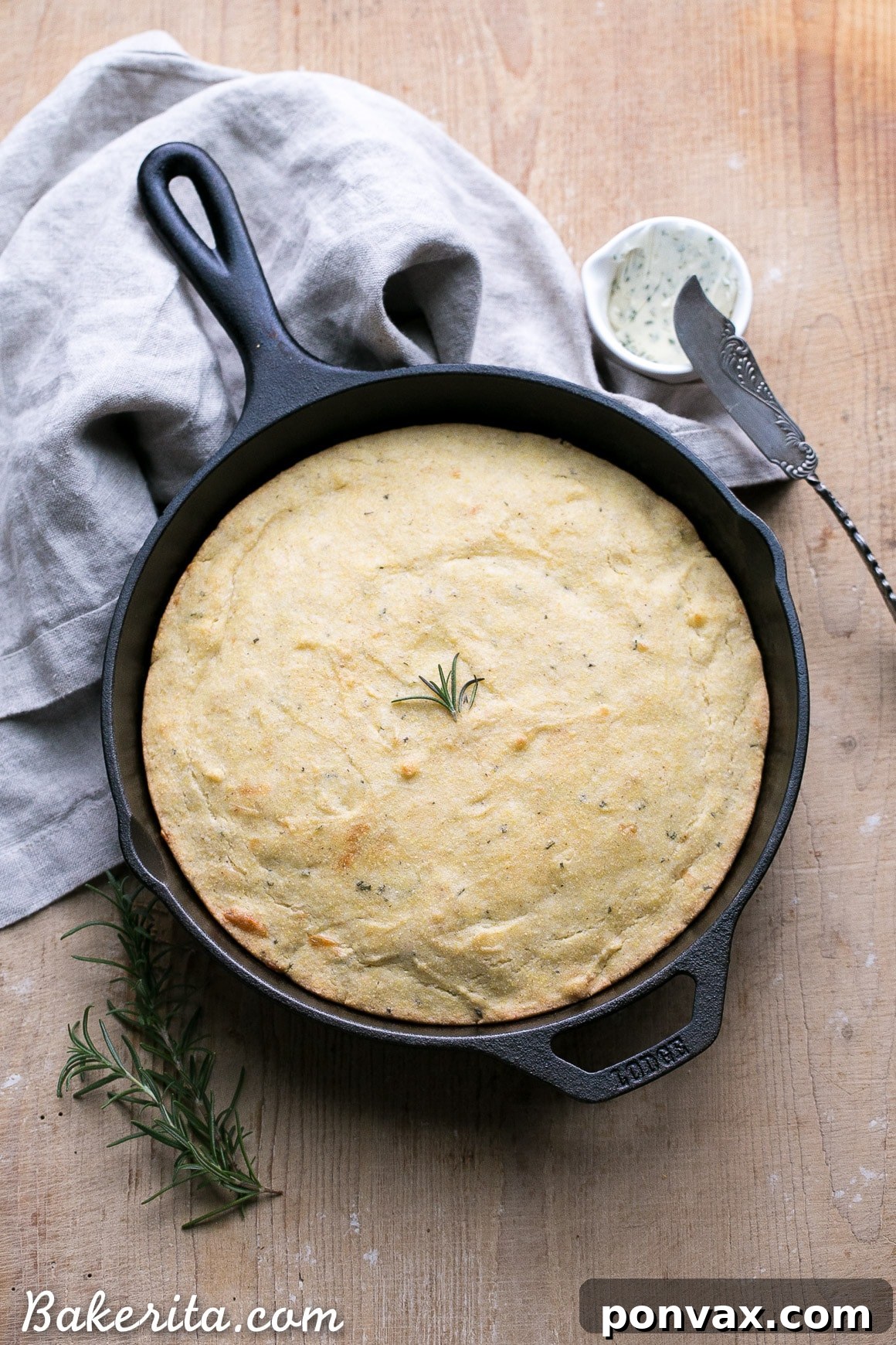This Gluten Free Asiago Rosemary Cornbread is an easy, savory cornbread that's moist and flavorful. A slice of this gluten-free cornbread is perfect with a slather of butter or served with a bowl of soup!