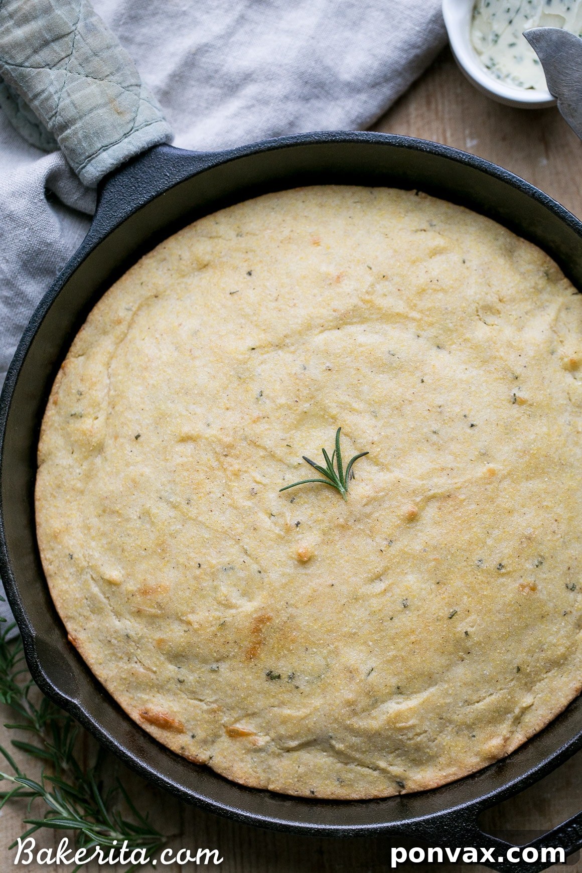 This Gluten Free Asiago Rosemary Cornbread is an easy, savory cornbread that's moist and flavorful. A slice of this gluten-free cornbread is perfect with a slather of butter or served with a bowl of soup!