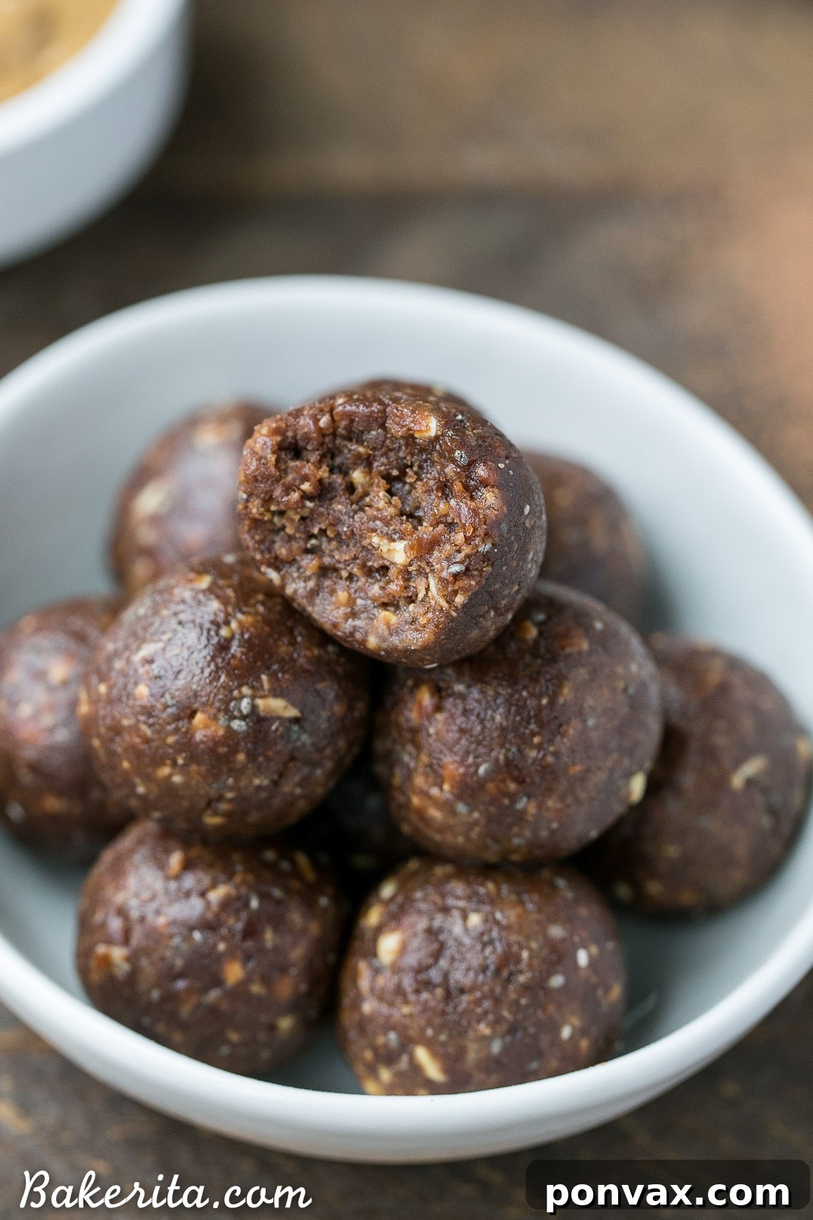 These Chocolate Peanut Butter Energy Bites are a fast, 5-ingredient recipe. Gluten-free, refined sugar-free, and vegan, they are naturally sweetened with dates and ready in 10 minutes for a healthy, delicious snack.