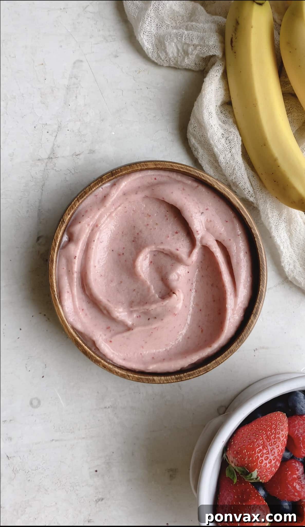 Smoothie bowl mixture poured into a bowl, ready for toppings.