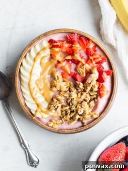 Strawberry Banana Smoothie Bowl with various toppings