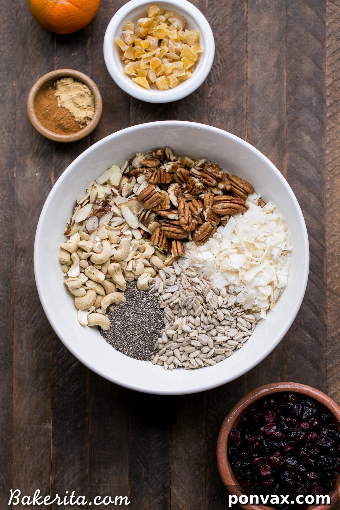 Paleo Vegan Grain-Free Orange Ginger Granola 3 A bowl of orange ginger grain-free granola mixed with nuts and seeds.