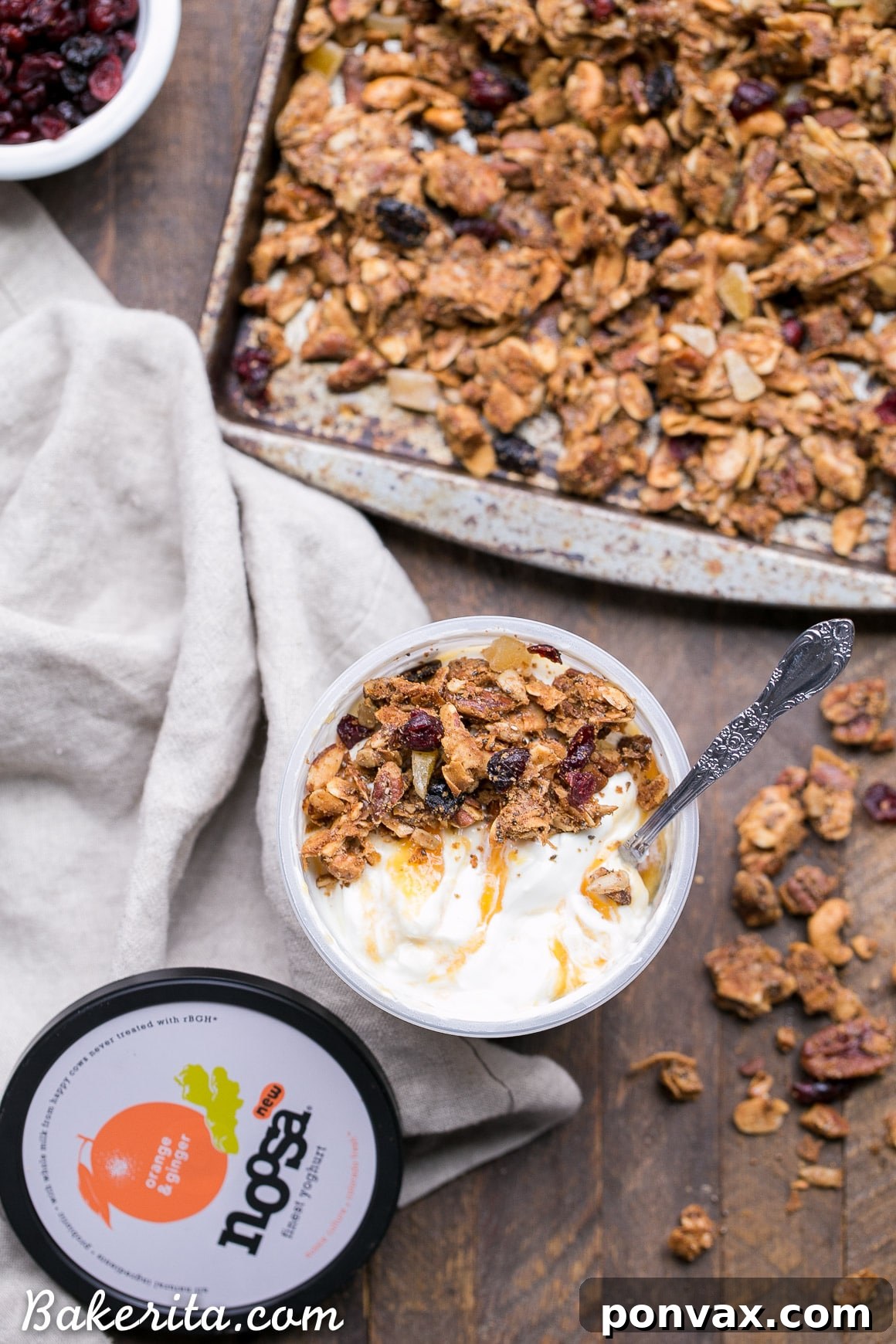 Paleo Vegan Grain-Free Orange Ginger Granola 4 Glass jars filled with Noosa yogurt, displaying the creamy texture and fruit swirls.