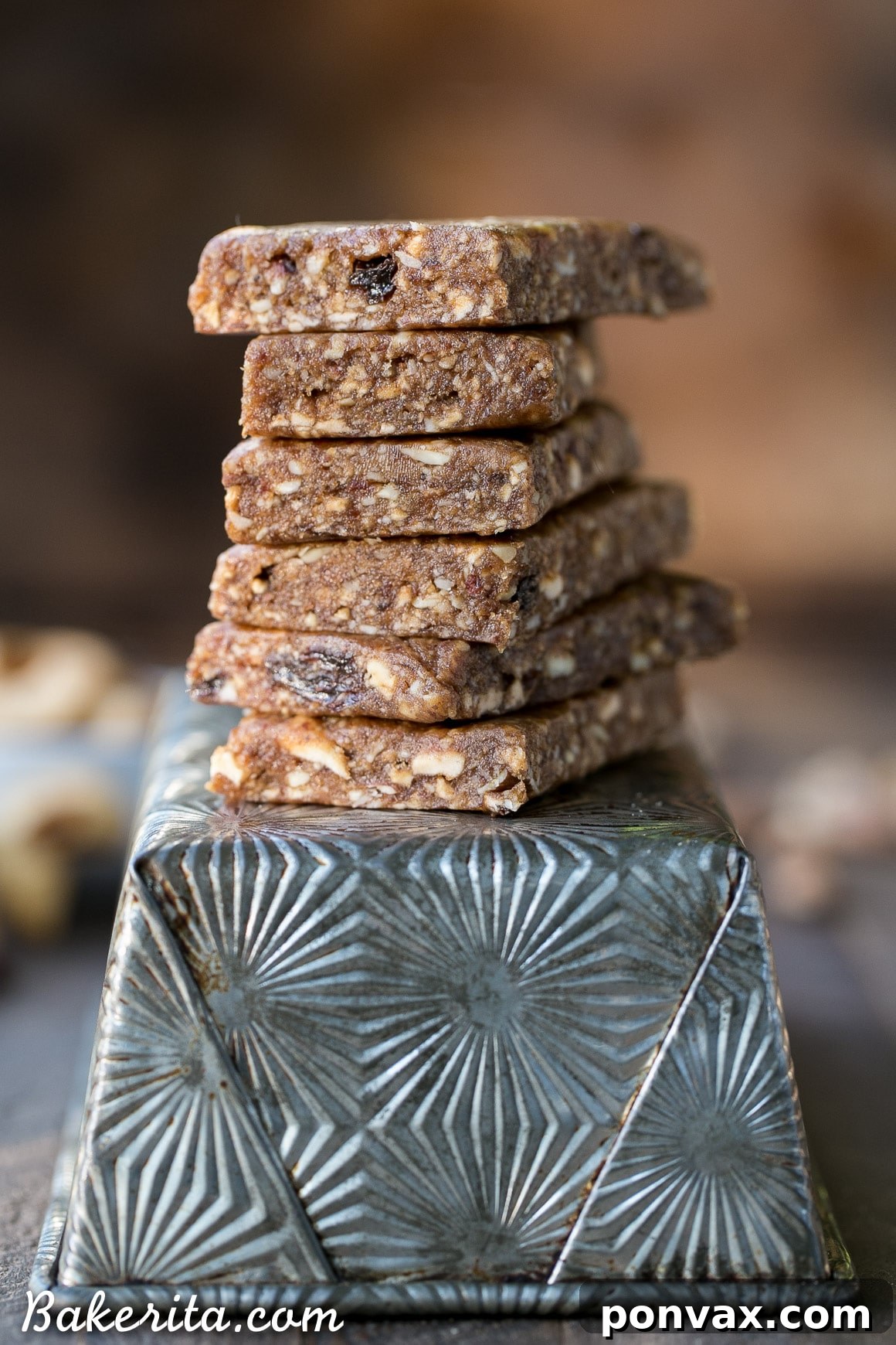 Homemade Apple Pie Larabars arranged on parchment paper, ready to be cut into snack-sized portions.