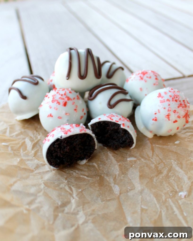 Homemade Chocolate Peppermint Truffles with White Coating Close-up of freshly dipped Chocolate Peppermint Truffles with sprinkles, showing their appealing texture