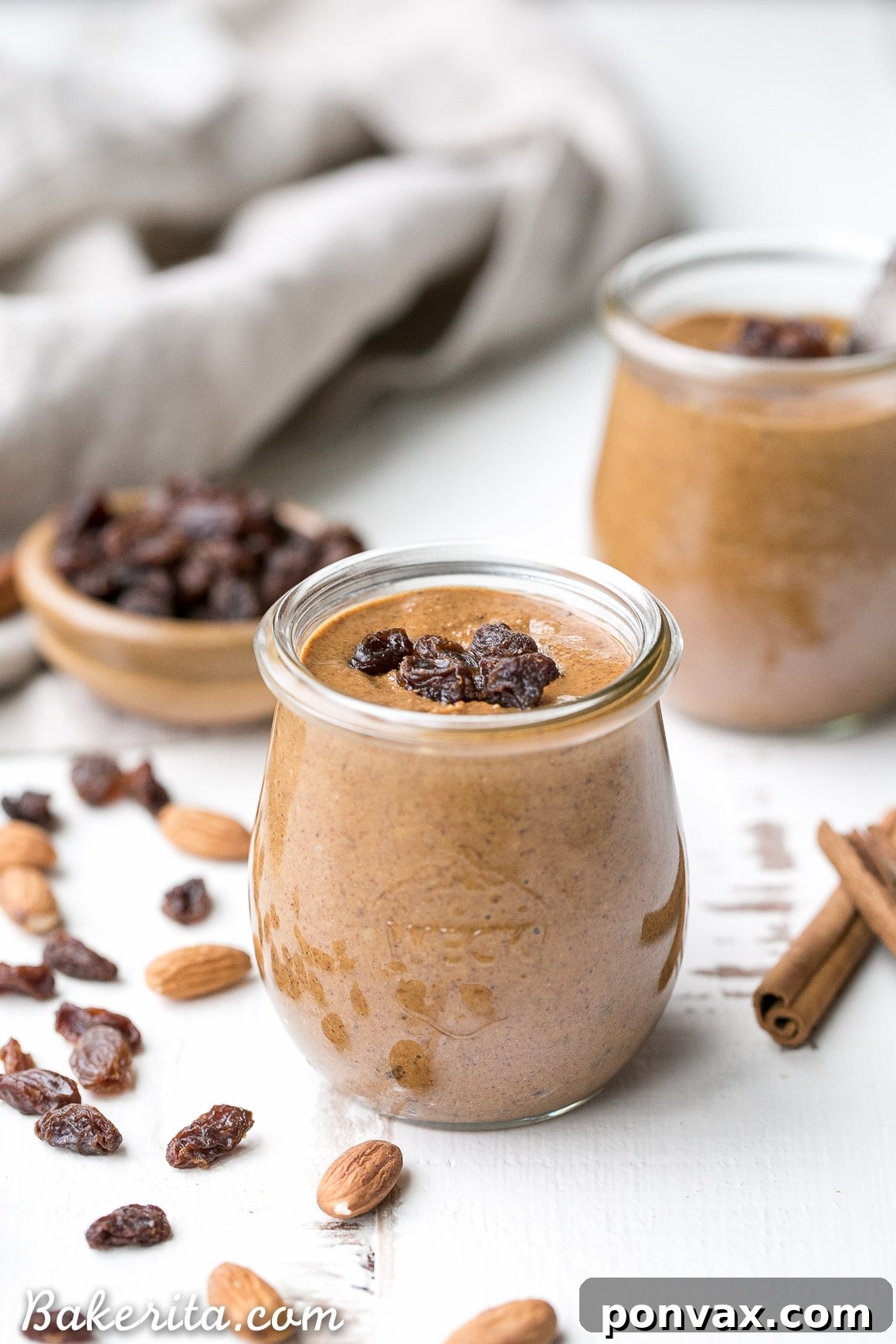 Smooth and creamy homemade Cinnamon Raisin Almond Butter with chewy raisins, perfect for spreading.
