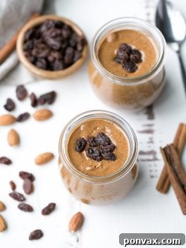 This homemade Cinnamon Raisin Almond Butter is smooth and creamy, with chewy bits of raisins in every spoonful! Spread it on apples, bananas, toast, or just enjoy it as is.