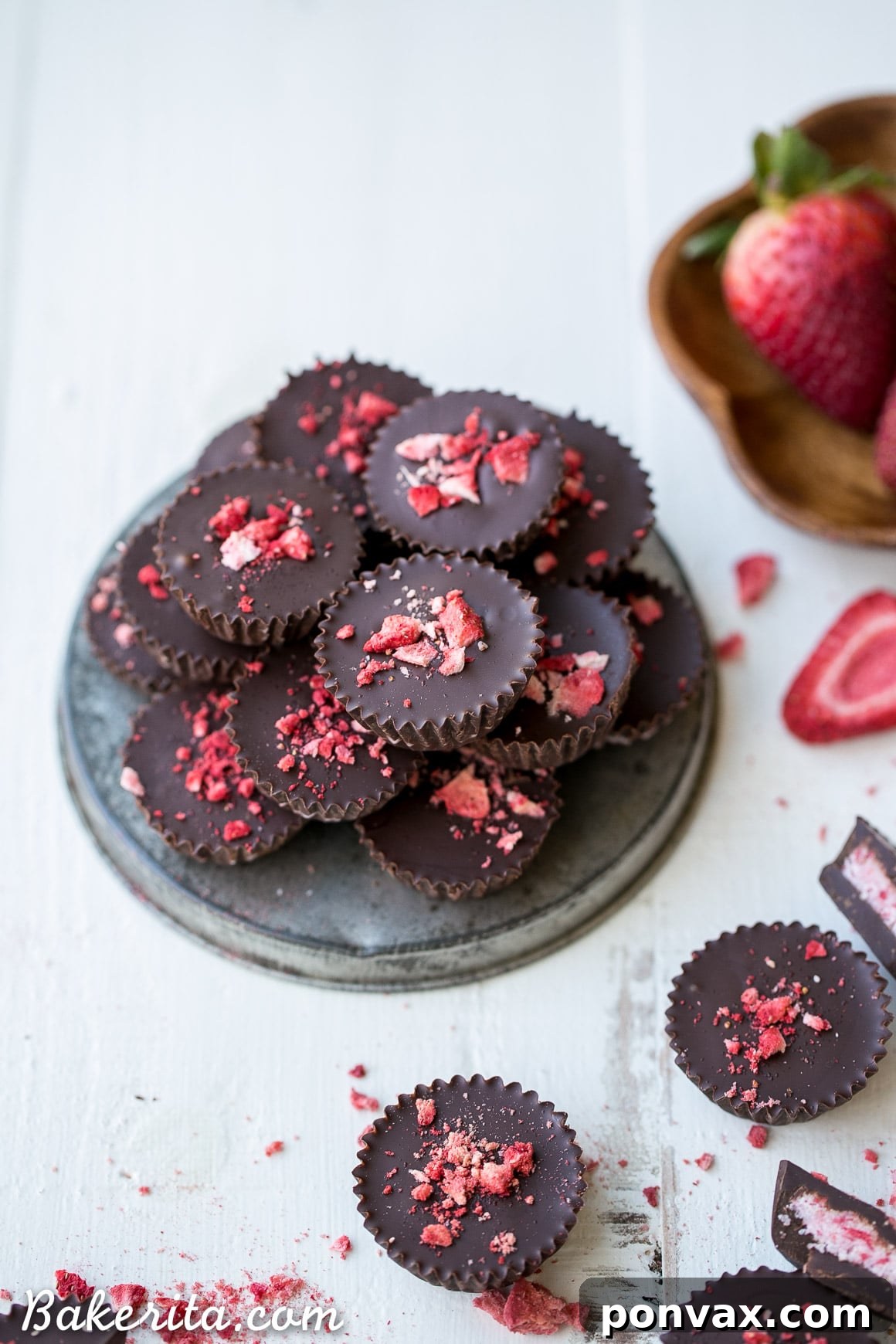 Hand holding a perfect chocolate strawberry cup, highlighting the texture and inviting presentation of this gluten-free, Paleo, and vegan treat.