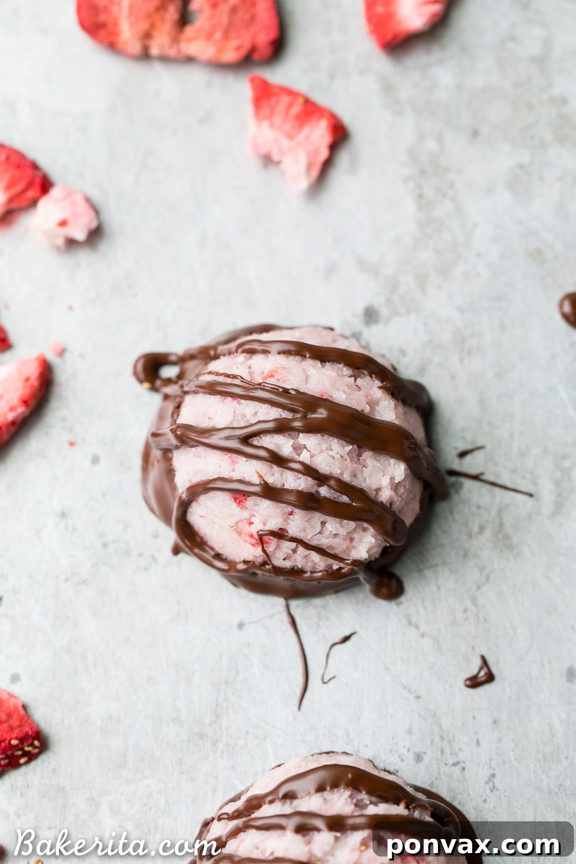 No Bake Vegan Chocolate Covered Strawberry Macaroons 5 Several No-Bake Chocolate Dipped Strawberry Macaroons with a visible creamy texture and enticing chocolate coating.