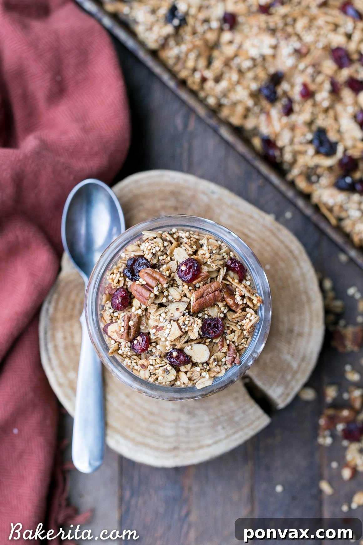 Wholesome Vegan Gluten Free Quinoa Granola 3 Close-up of golden brown Quinoa Granola clusters baking on a sheet pan, showcasing its irresistible texture.