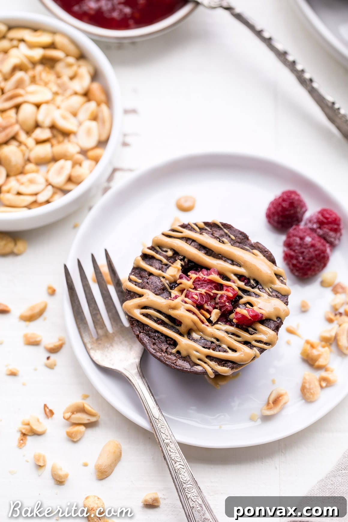 Close-up of a stack of gluten-free peanut butter and jelly brownie bites, showing the fudgy texture and a hint of filling.