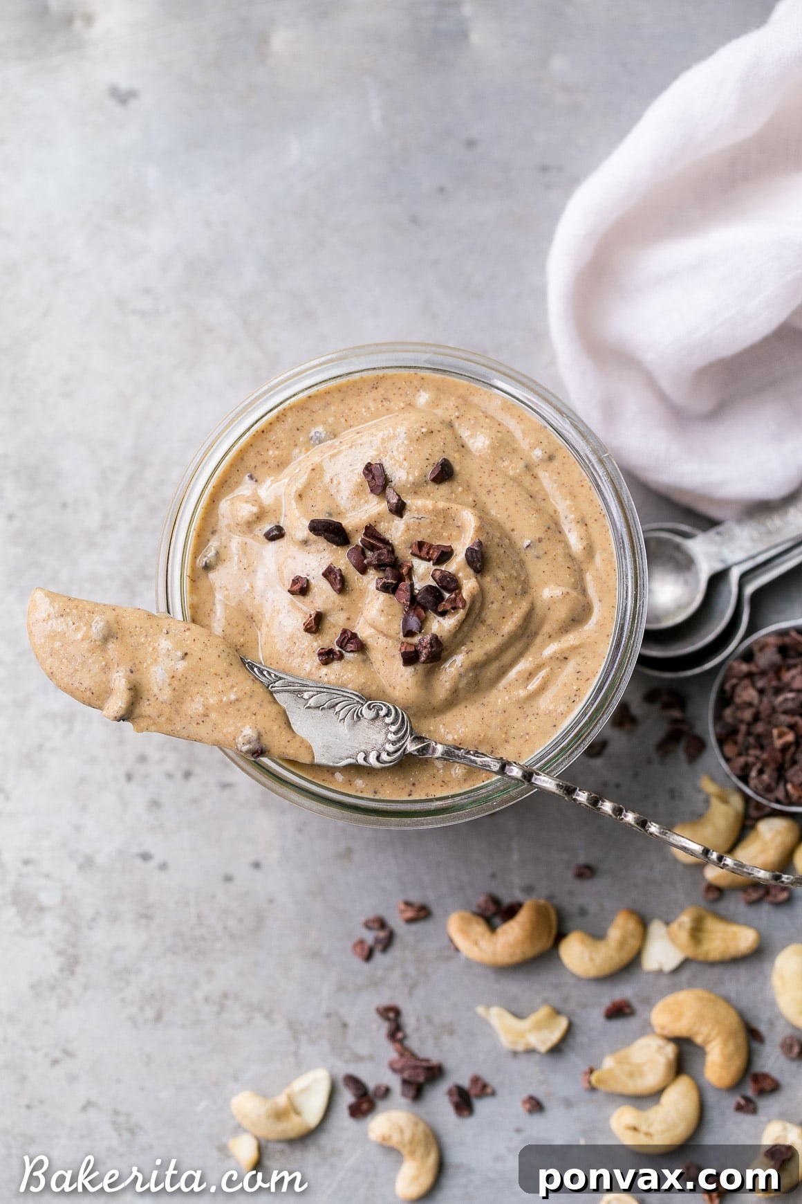 Heavenly Chocolate Chip Cookie Dough Nut Butter 6 Measuring out ghee and other wet ingredients to be added to the nut butter base.