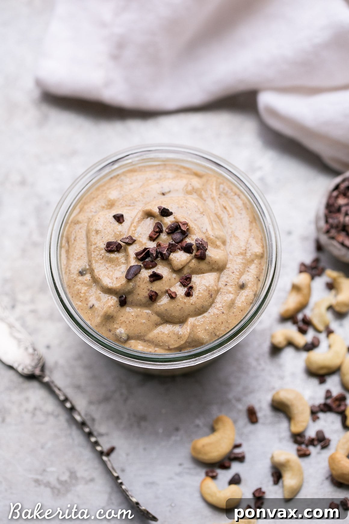 Heavenly Chocolate Chip Cookie Dough Nut Butter 7 A generous dollop of Chocolate Chip Cookie Dough Nut Butter on a spoon, ready to be eaten.