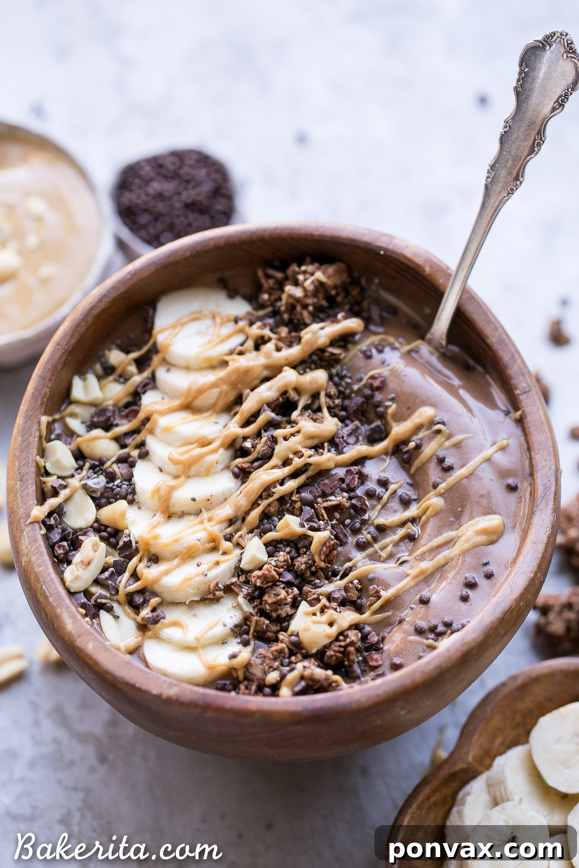 A close-up shot of the Chocolate Peanut Butter Smoothie Bowl, highlighting its smooth, thick texture and readiness for toppings.