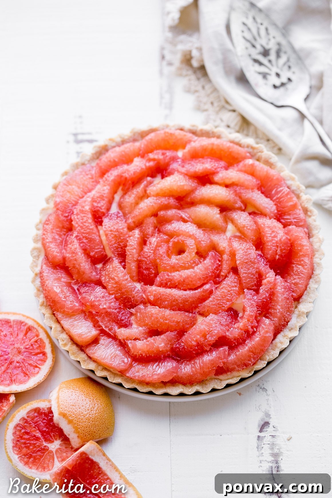 Stunning Grapefruit Tart showcasing vibrant pink segments on a silky curd, perfect for a healthy dessert.