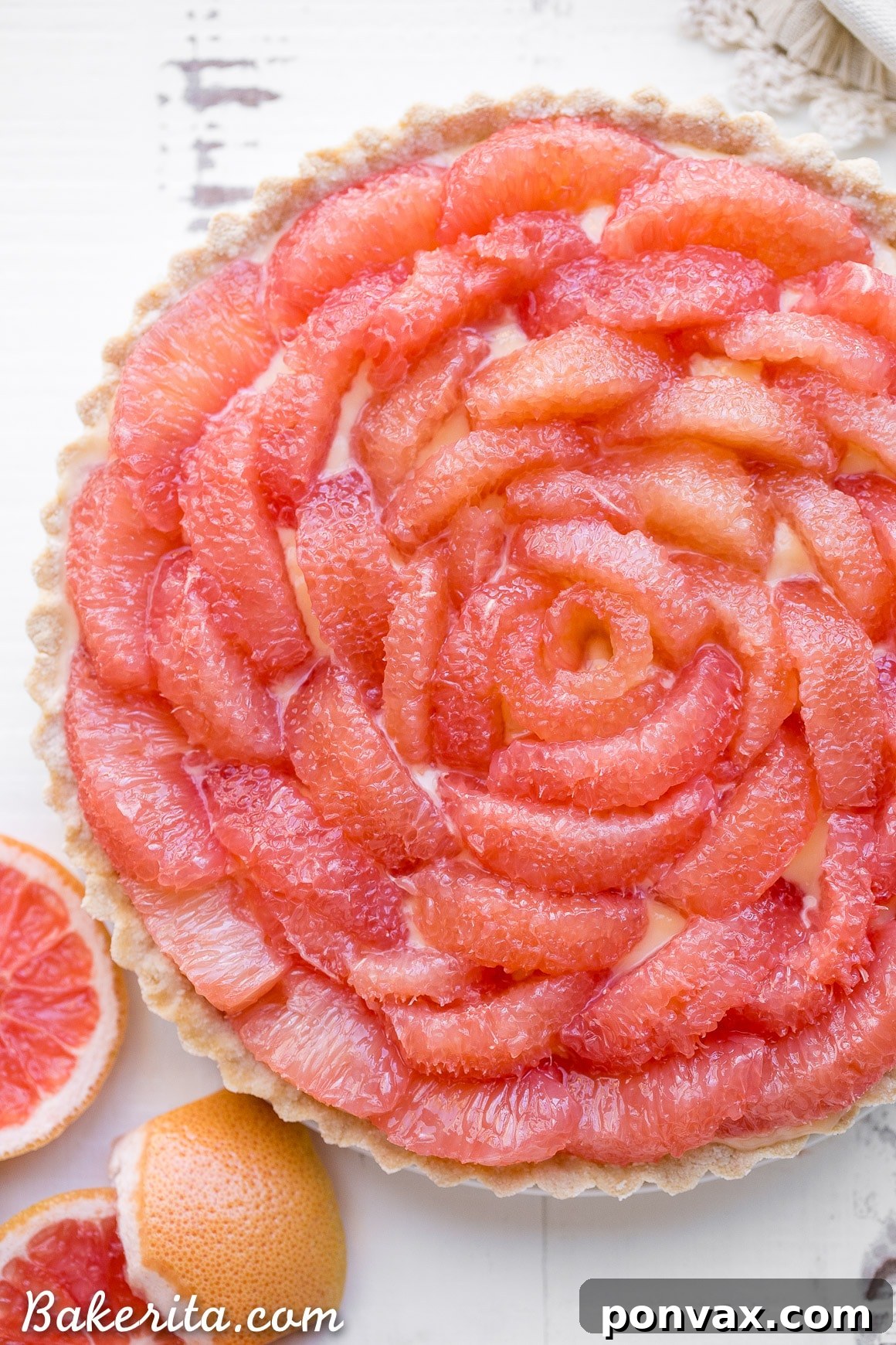An overhead shot showcasing the meticulously arranged grapefruit segments creating a beautiful pattern on the tart.