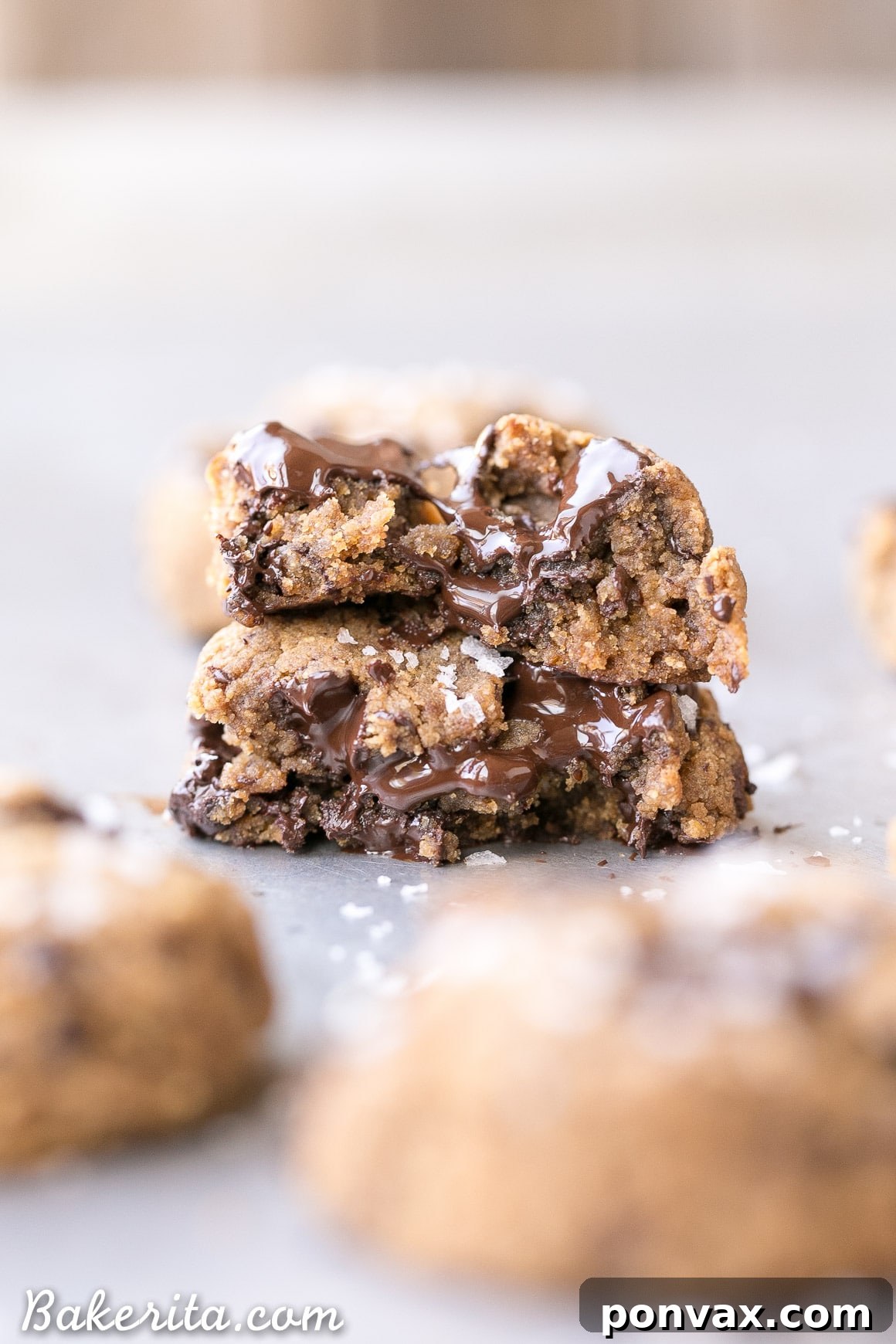 A close-up of a stack of fresh-baked Gluten-Free Coconut Flour Chocolate Chip Cookies, emphasizing their beautiful golden edges and melty chocolate.