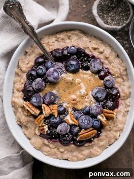 A bowl of blueberry muffin oatmeal, ready to be enjoyed.