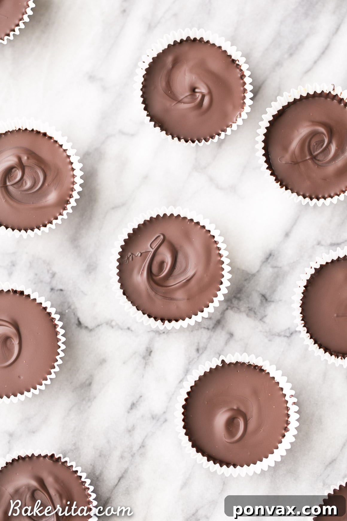 Decadent Chocolate Chip Dough Cups 4 A stack of healthy chocolate chip cookie dough cups, showing the perfect layers of chocolate and cookie dough. Gluten-free, Paleo, and vegan friendly.