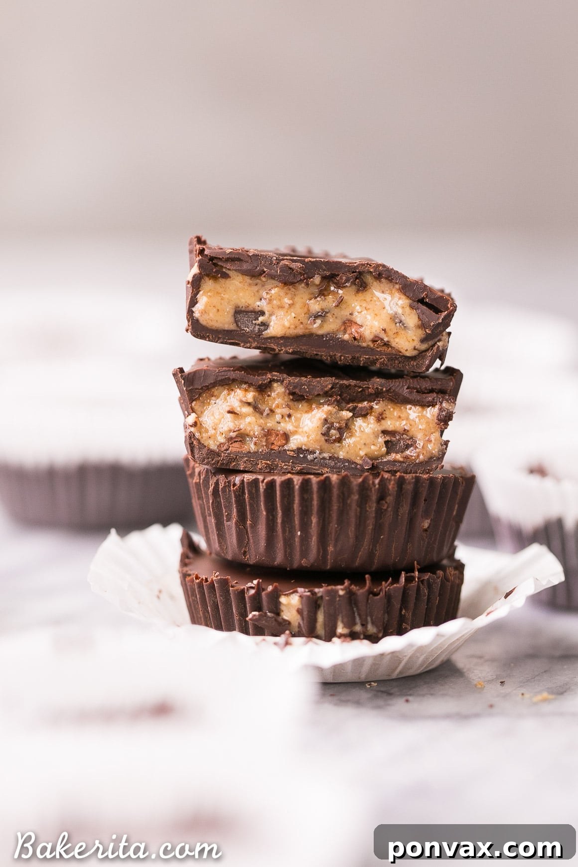 Decadent Chocolate Chip Dough Cups 7 A half-eaten chocolate chip cookie dough cup revealing the rich, gooey interior, a perfect healthy, no-bake, and vegan dessert.